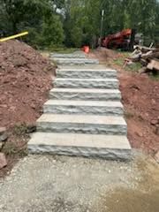 Stone steps built into a sloped yard